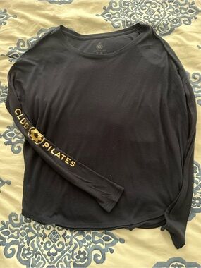 Club Pilates Black Long Sleeve Tee with Gold Sleeve Logo